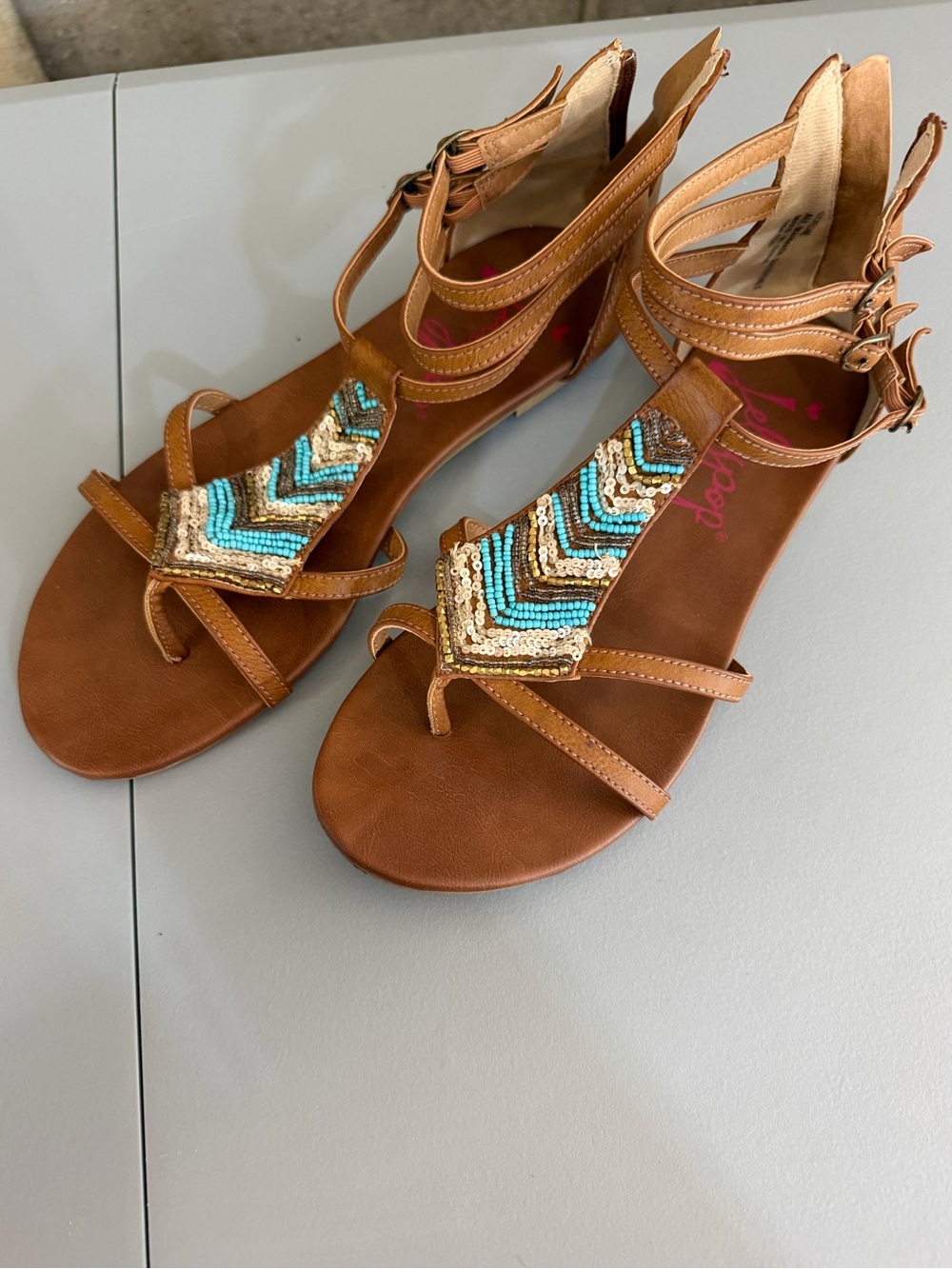 Jellypop Brown Beaded T-Strap Sandals with Turquoise Accents